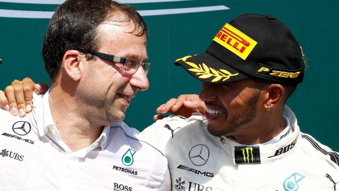 a couple of men standing next to each other