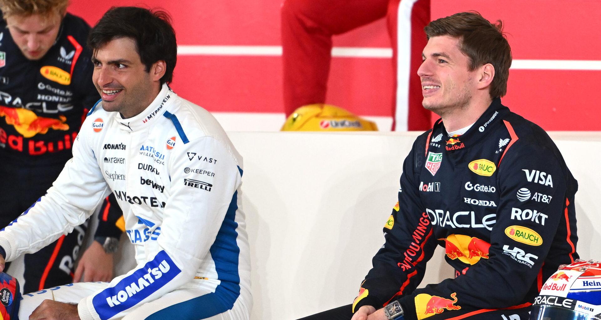 a couple of men sitting next to each other